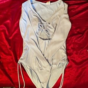 Celebrity pink. long sleeve one piece swimsuit. size large color blue.
